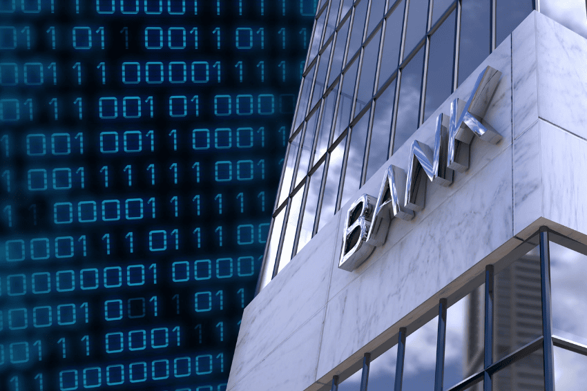 Bank building alongside IT code representing financial services in digital disruption