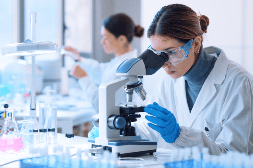 Person working in a lab representing the healthcare industry